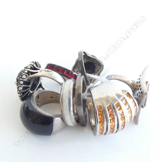 EIGHT SILVER RINGS