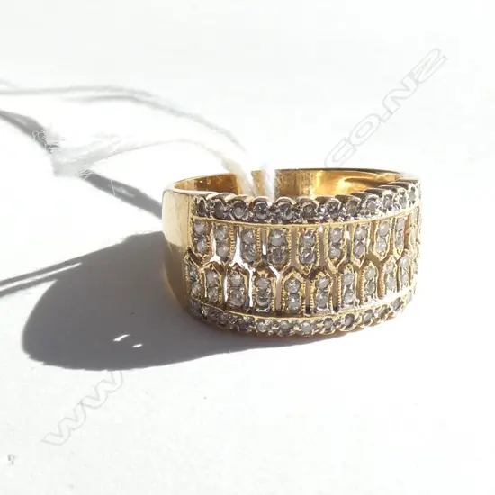 18CT GOLD AND DIAMOND ENCRUSTED BAND