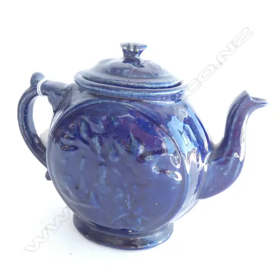 A late 19thC N.Z. Luke Adams 'Kowhai' blue glazed teapot