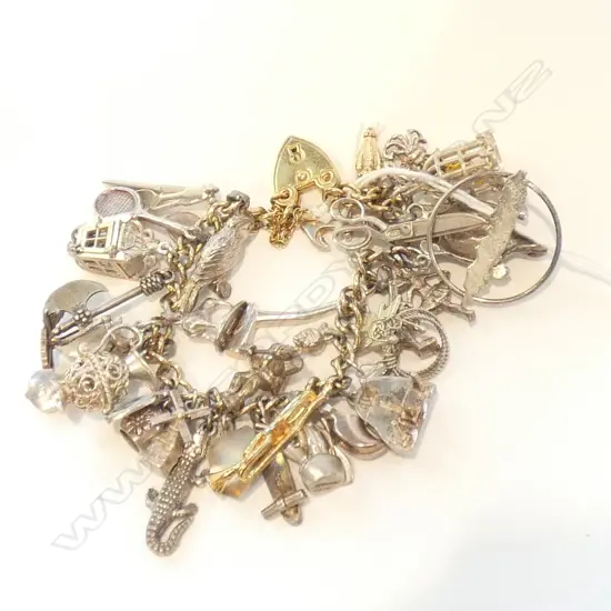 STG SILVER CHARM BRACELET 83 GRAMS