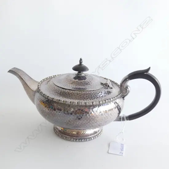 HAMMERED SILVER PLATE FOOTED TEAPOT - BAKELITE HANDLES  H.  150MM APPROX