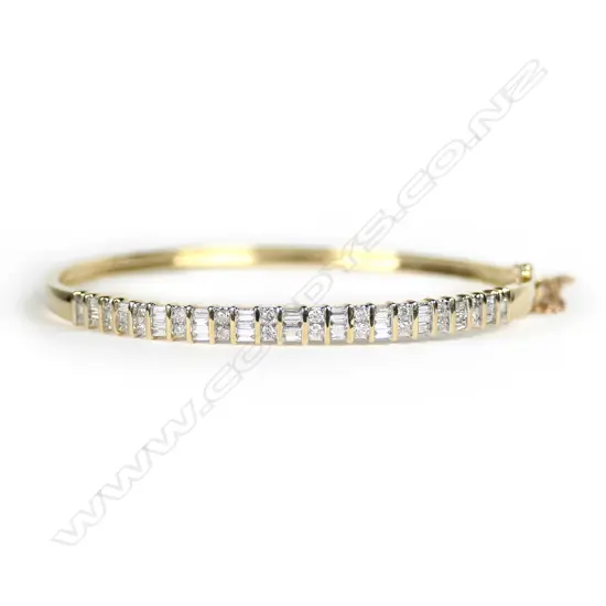 10CT GOLD FANCY 1ct DIAMOND SET BANGLE....