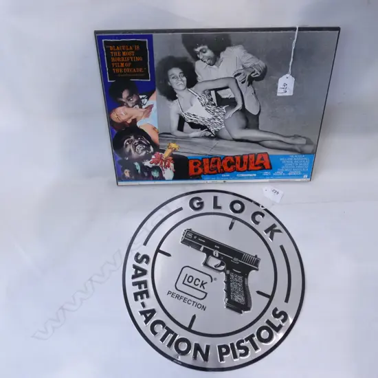 MOUNTED OLD 'BLACULA' POSTER (350 X 280MM) & TIN PLATE GLOCK PISTOL ROUND SIGN (DIA 300)