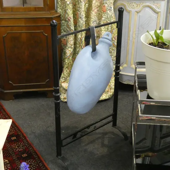 BLUE PAINTED CERAMIC WATER JUG ON BLACK METAL STAND H.1025mm