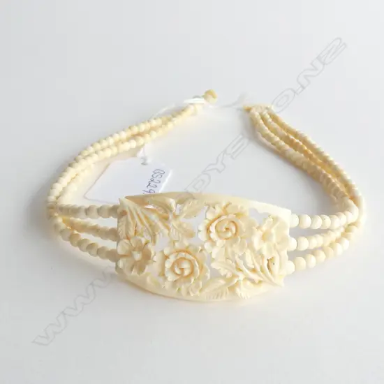 CARVED IVORY AND BEAD CHOKER