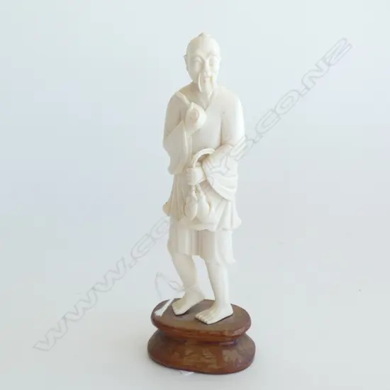 JAPANESE IVORY MAN WITH FISH ON WOOD STAND H.150mm