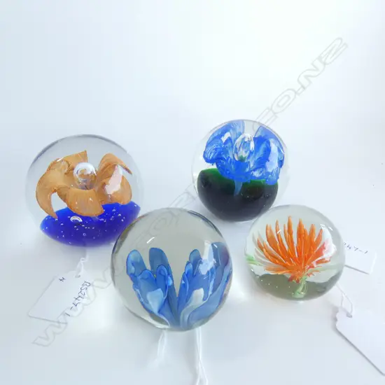 FOUR ASSORTED PAPER WEIGHTS