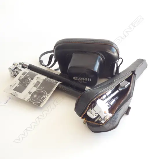 A CANON QL 35 MM CAMERA WITH 2 TRIPODS