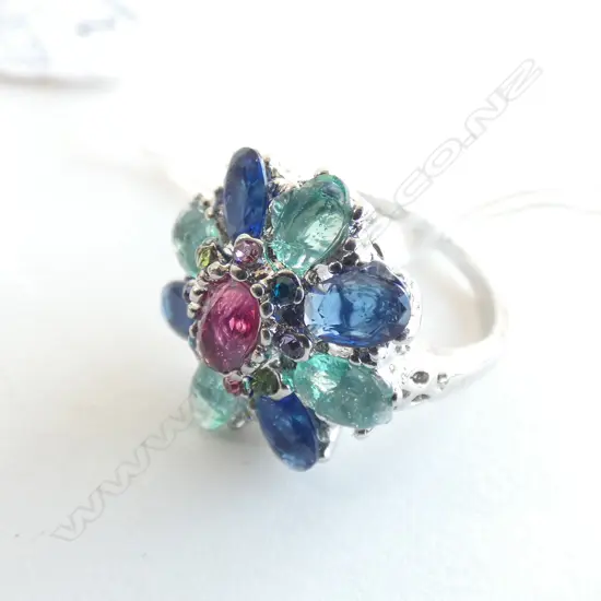 SILVER COLOURED RING MULTI COLOURED STONE. SIZE 8 (P 1/2)
