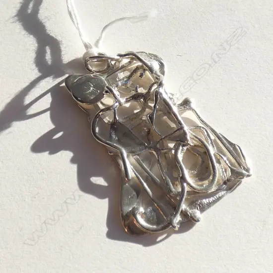 ABSTRACT SILVER PENDANT
