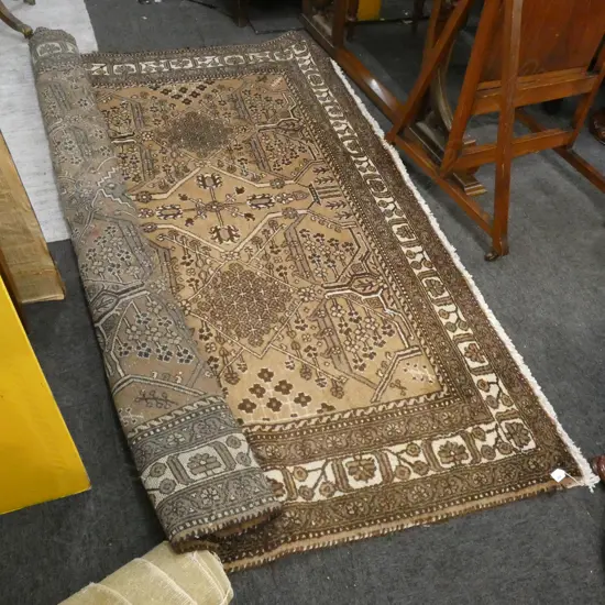 HAND KNOTTED BROWN WOOL PILE RUG...