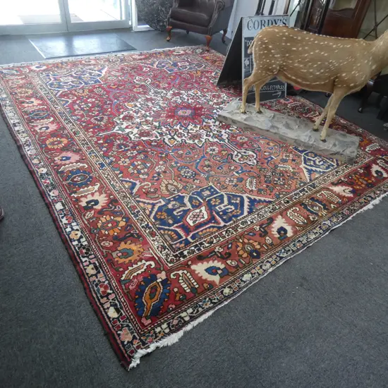 LARGE IRANIAN HANDKNOTTED WOOL PILE RUG...