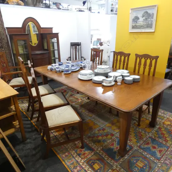 OAK ARTS AND CRAFTS EXTENSION DINING TABLE AND EIGHT CHAIRS