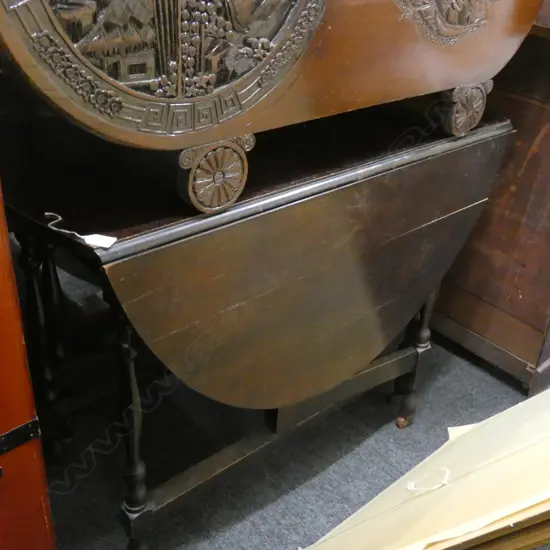 MAHOGANY DROP SIDE TABLE ON CASTORS...