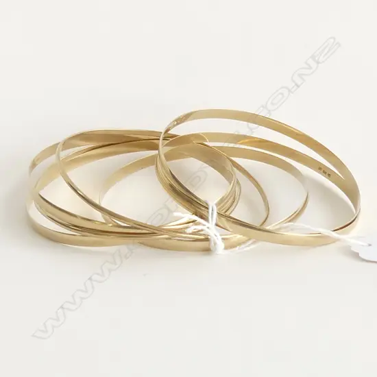 (81) SEVEN 9CT GOLD BANGLES 32gm