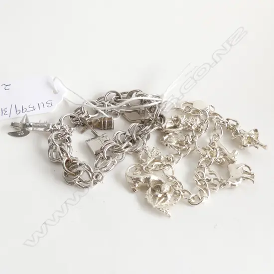 2 STG CHARM BRACELETS 63 GRAMS (1 SCOTTISH THEMED)
