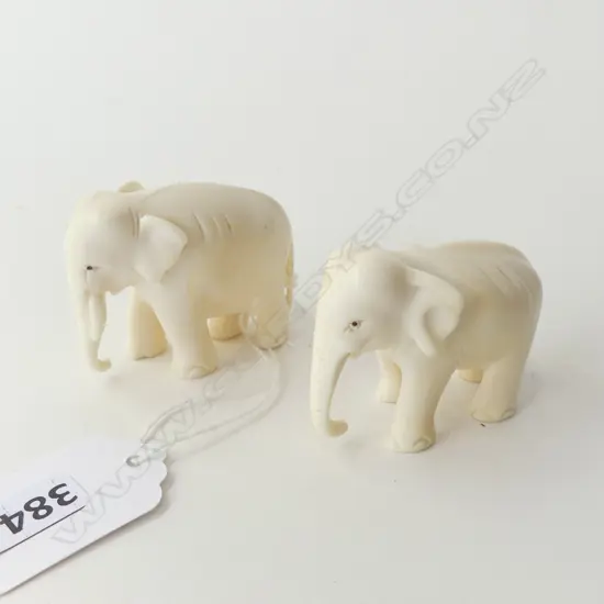 2 SMALL CARVED IVORY ELEPHANTS H. 40mm
