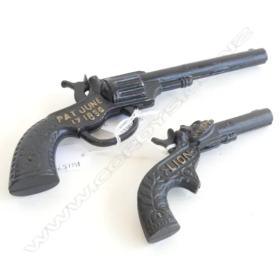 2 CAST ZINC REPRODUCTION CAP GUNS; 'COLUMBIA' & 'LION' L.220mm