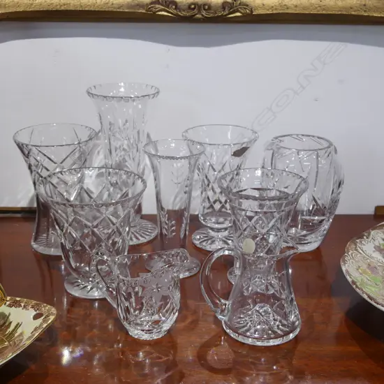SEVEN CUT CRYSTAL VASES’ + TWO SMALL JUGS