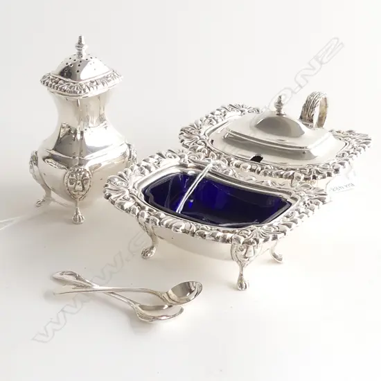 3 PC EPOC CRUET SET; PEPPER SHAKER, BLUE GLASS LINED SALT & MUSTARD & 2 SPOONS. ORNATE RIMS & LIONS HEAD ON LEGS