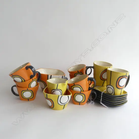 20 PCS RETRO ESSENCE 'BEATNICK' PCS; MUGS & SAUCERS, LG CUPS & SAUCER, JUG, 2 BOWLS.  A FEW HAVE CHIPS