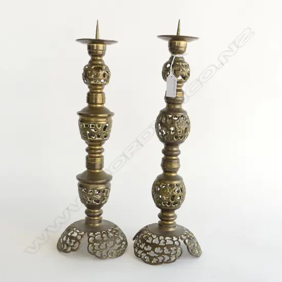 TWO BRASS PRICKET CANDLESTICKS H.380mm and 400mm