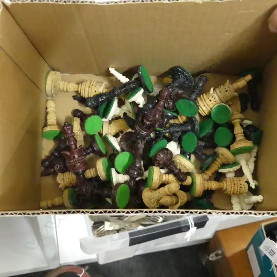 2 SETS OF CARVED INDONESIAN CHESS PCES