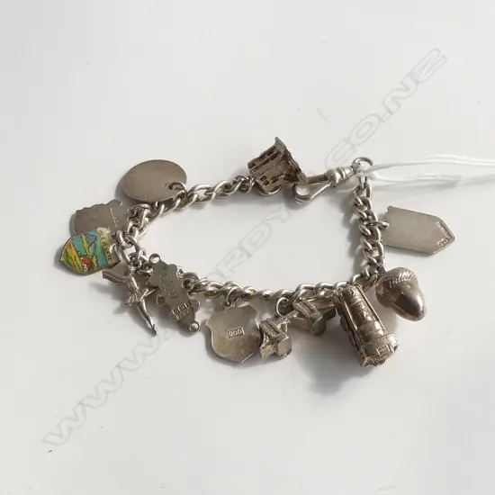 SILVER CHARM BRACELET W MANY SILVER CHARMS