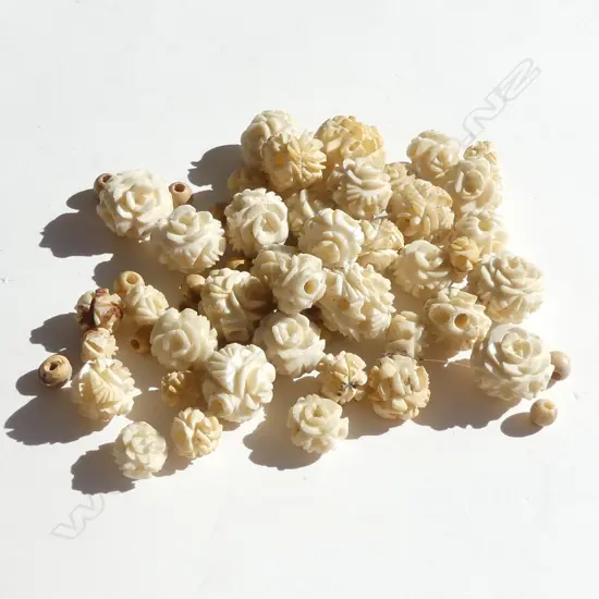 SMALL BAG ASSORTED FLORAL CARVED IVORY BEADS
