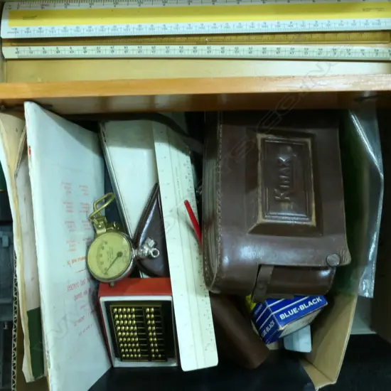 BOX LOT OF ARCHITECTURAL DRAWING INSTRUMENTS, SLIDE RULES, PLUS WOODEN BOX OF SCALE RULES, BOOKS, COMPASSES + CAMERA ETC