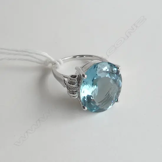 SILVER RING WITH TOPAZ STYLE STONE AND CZs, SIZE N