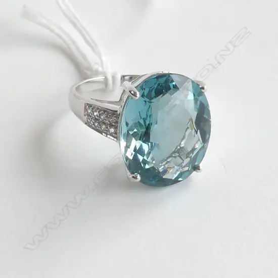 SILVER RING WITH TOPAZ STYLE STONE AND CZs, SIZE N