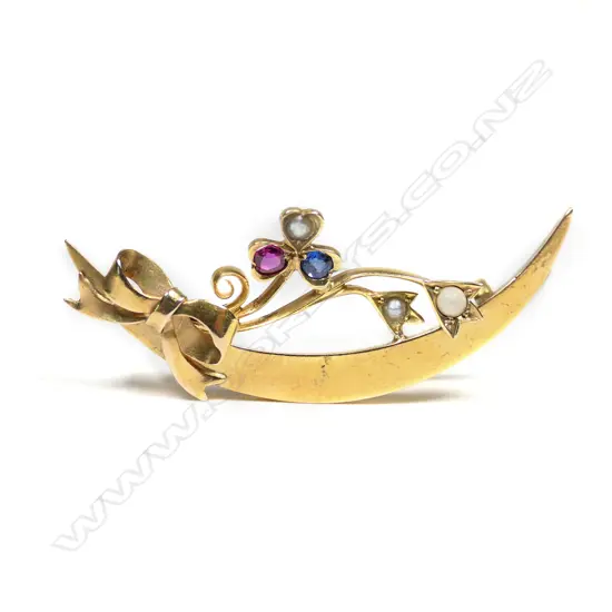 An Edwardian 15ct gold seed pearl ruby and sapphire crescent brooch,