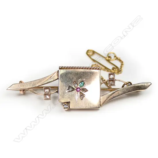 An Edwardian 9ct gold and gem set brooch,