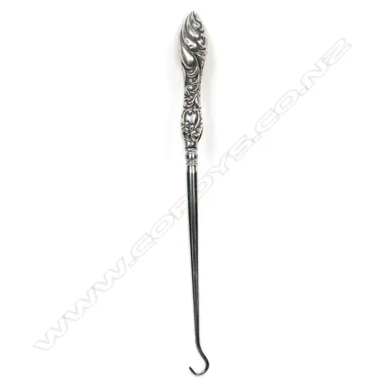 An Edwardian silver button hook