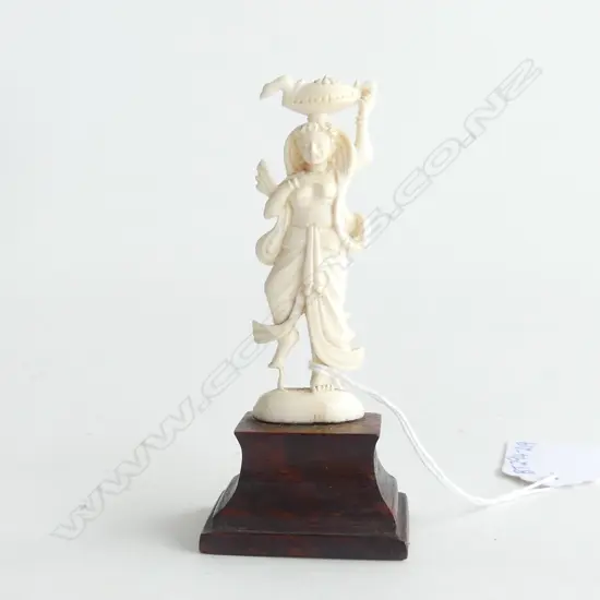 IVORY CARVED FIGURINE OF FEMALE SNAKE CHARMER, ON WOODEN MOUNT H.100mm