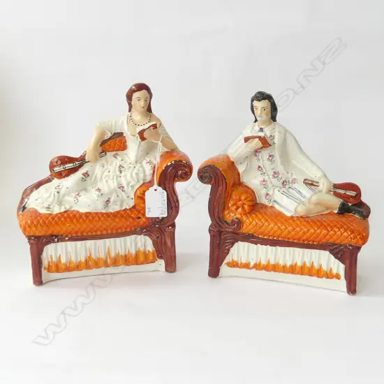 PR VICTORIAN FLATBACK STAFFORDSHIRE FIGURES; COUPLE RECLINING ON DAY BEDS W.200mm