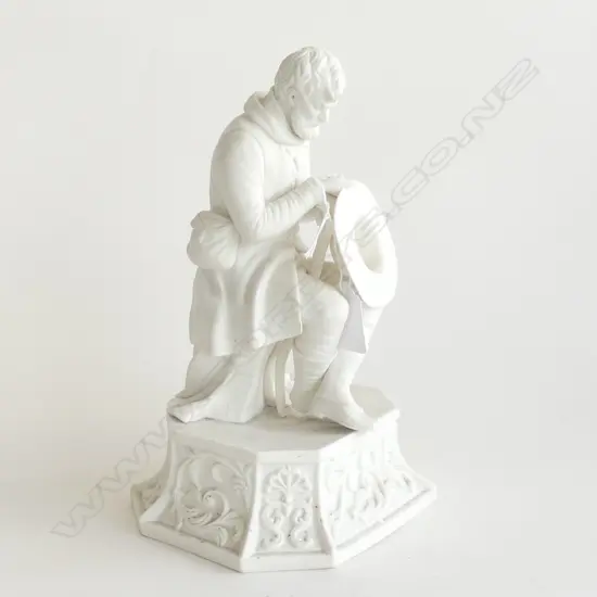 VICTORIAN PARIAN FIGURE GENTLEMAN SEATED AND HOLDING A HAT. H.250mm