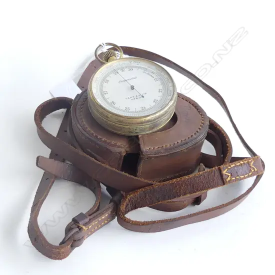 A gilt metal cased aneroid pocket barometer