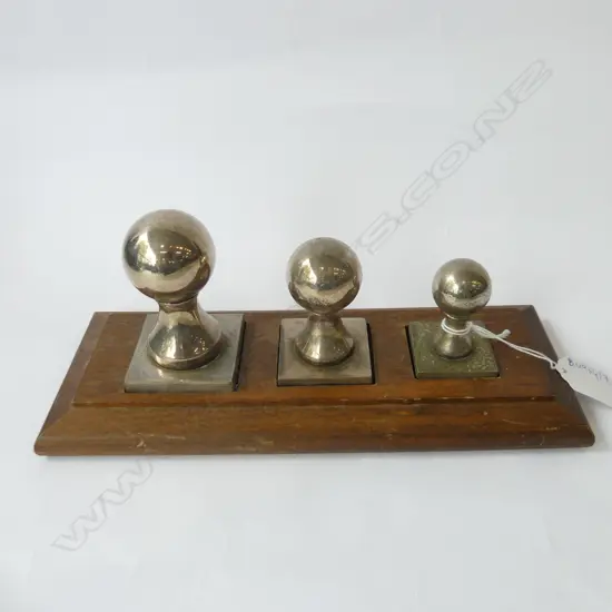 3 SILVER METAL PAPERWEIGHTS ON STAND W.250mm