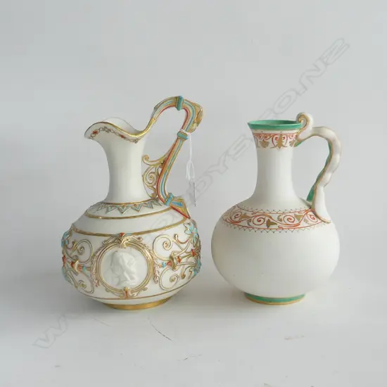 2 VINTAGE JUGS - ORNATE DECORATIONS & HANDLES H.260 & 250mm, MARKS /SIGNATURE(?)TO THE BASE OF LARGER VASE
