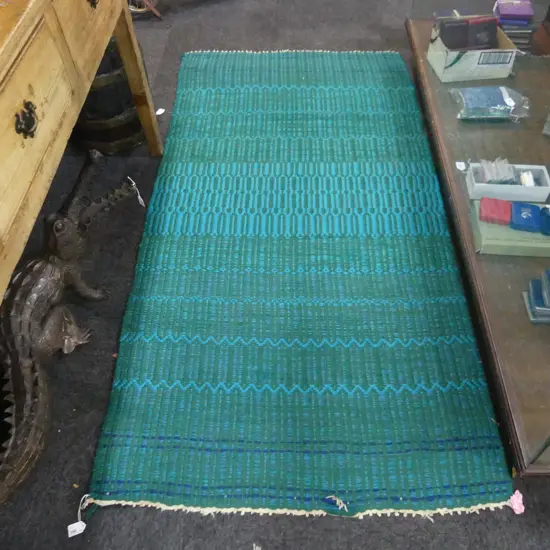 GREEN WOOLEN RUG