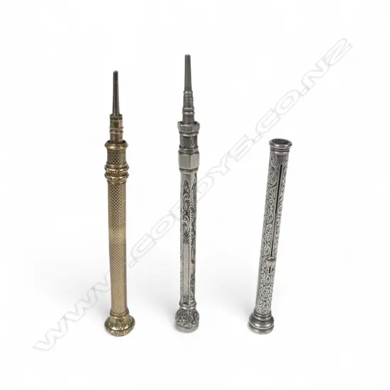 A Victorian sterling silver combination pen and propelling pencil, along with two others,