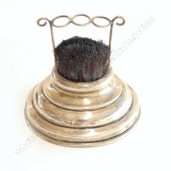 An uncommon boar's bristle and sterling silver nib wipe,