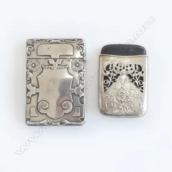 Two silver visiting card cases, one American, one English,