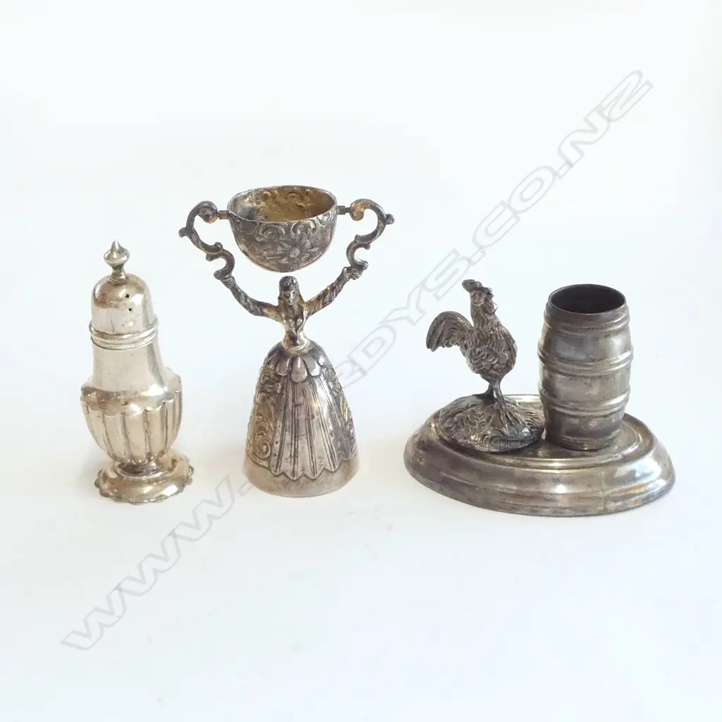 A sterling silver gilt wager cup, a silver pepperette and a plated toothpick stand, Image 1++
