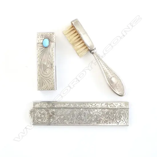 A silver handled toothbrush, a silver comb case and an 800 silver lipstick case with sprung mirror.