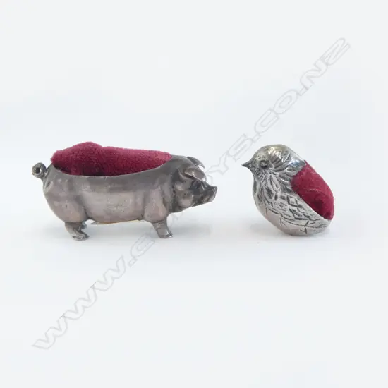 Two miniature silver pin cushions