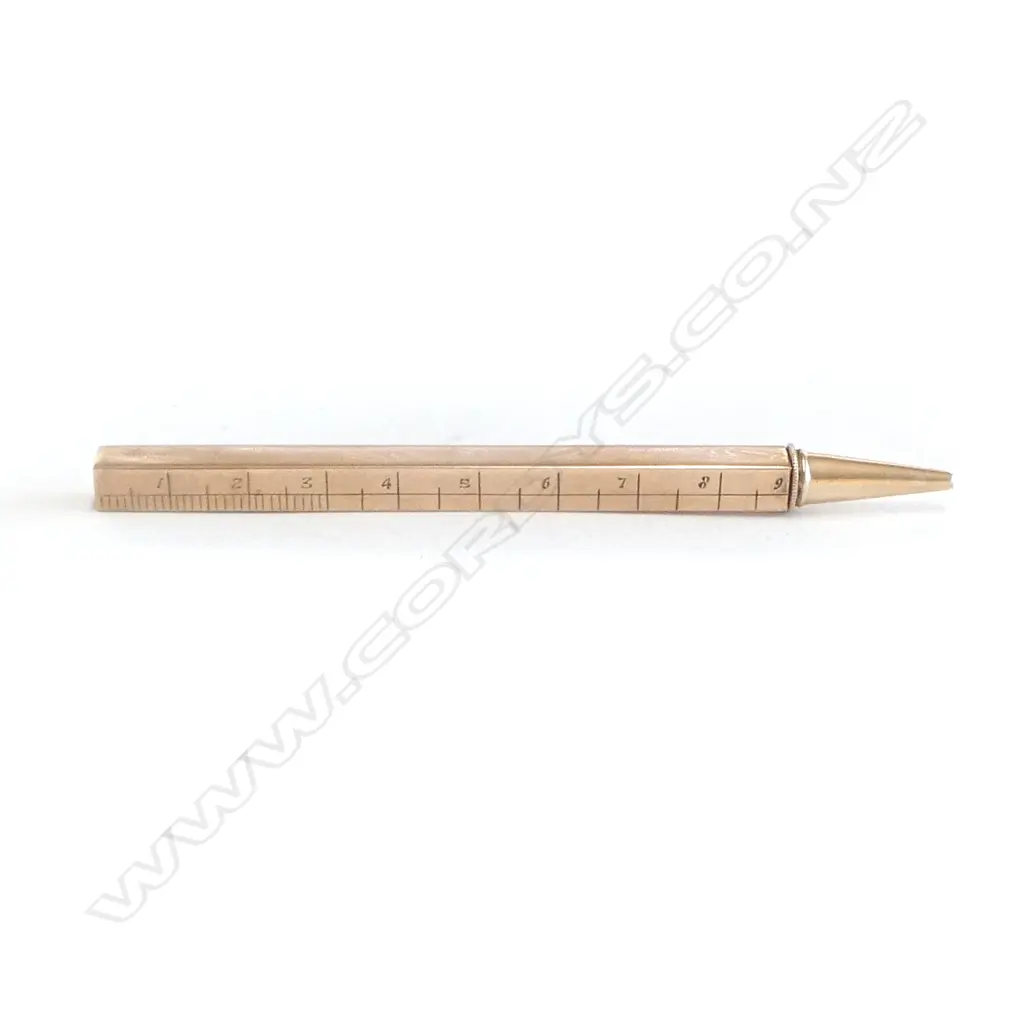 A 9ct gold cased telescoping propelling pencil with engraved ruler scales, Image 1++