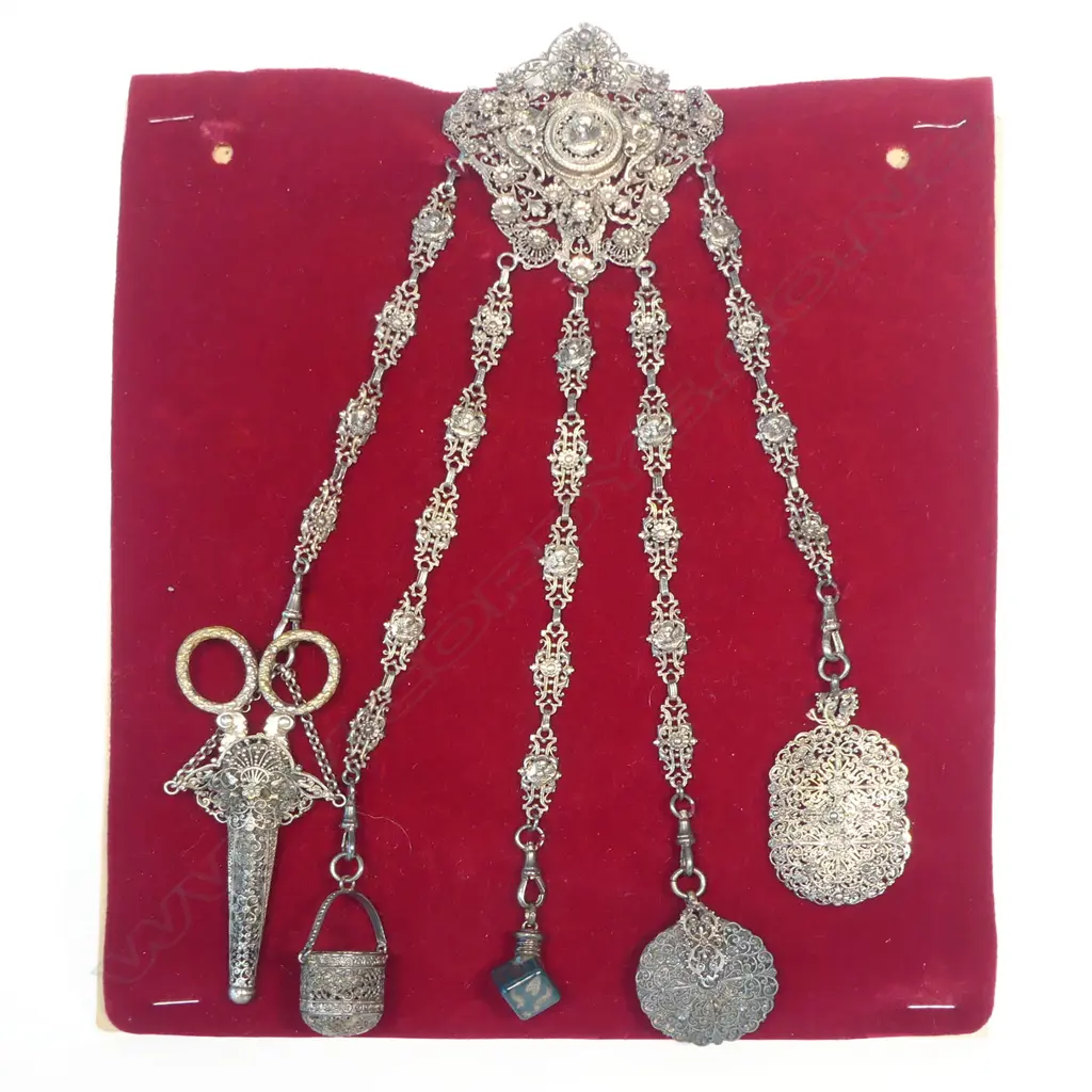 An unmarked possibly Continental silver chatelaine with five suspended accoutrements, Image 1++